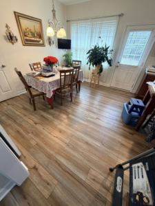 Beautiful new wood-look plank flooring installed in a dining room by Master Renovations LLC in Englewood, CO.