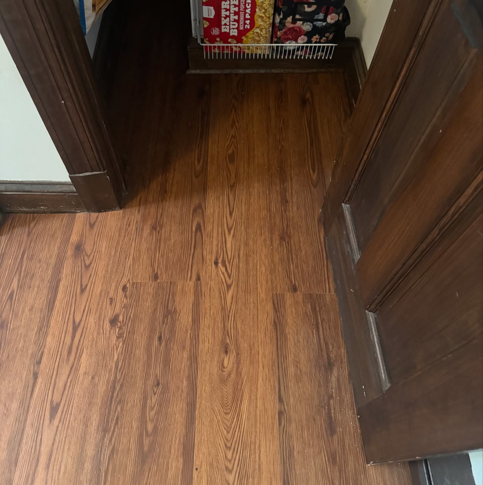 New wood-look flooring installation completed by Sanchez & Hall Construction in Richmond, VA.