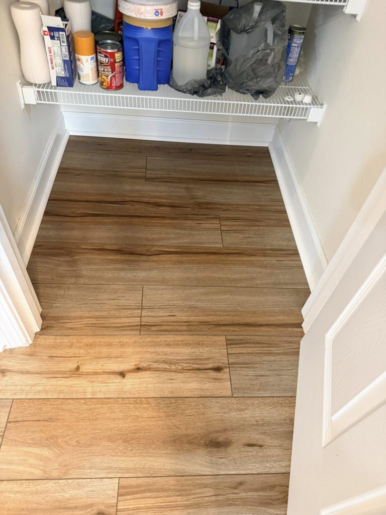 Efficient wood-look plank flooring installed in a pantry by Master Renovations LLC in Englewood, CO.