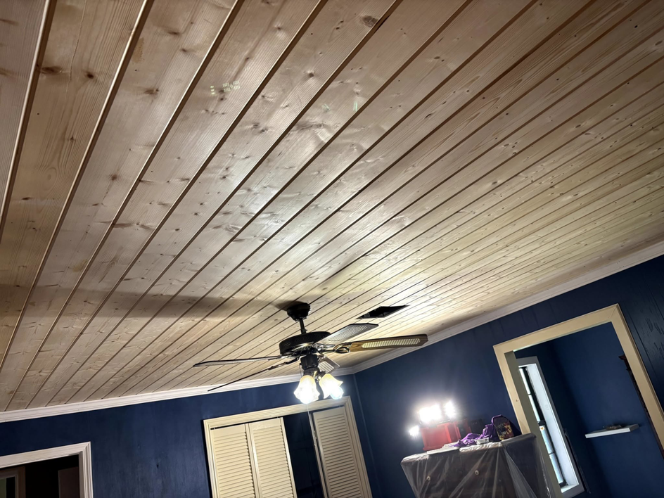 Installation of a new wood plank ceiling and ceiling fan by Verkler Development LLC in Lake Charles, LA.