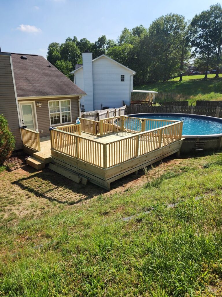 A newly constructed wooden deck built around an above-ground swimming pool by Richwood Remodeling & Outdoor in Nashville, TN.