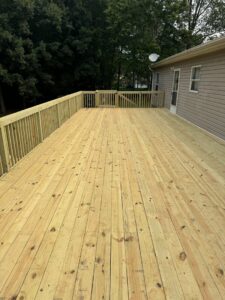 A large, newly constructed wooden deck built by Contractor Kev LLC, a handyman service in Winston-Salem, NC