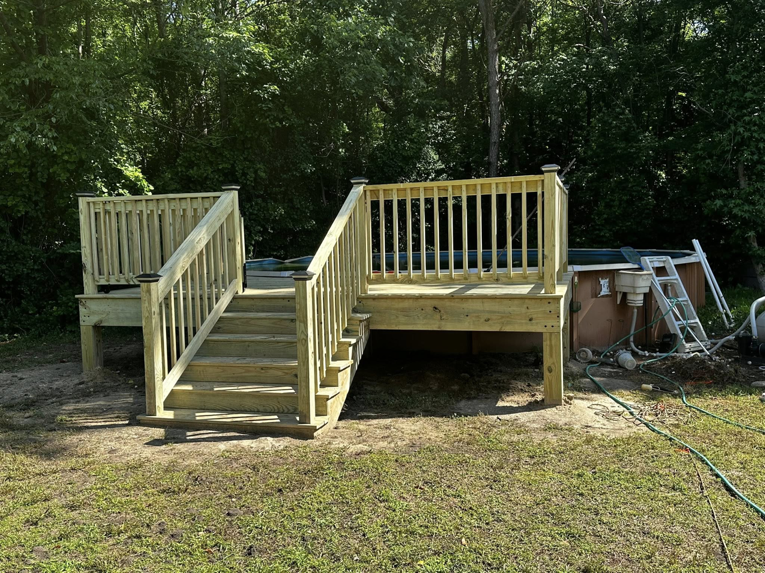Newly constructed wooden deck with stairs for an above-ground pool by Donald Home Improvements, llc in Milford, DE.