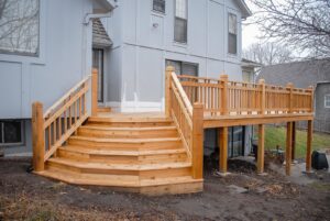 A newly constructed multi-level wooden deck with stairs by Four Seasons Building & Remodeling in Mauldin, SC.