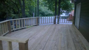 A newly built wooden deck with sturdy railings by Randolph Residential Repair in Durham, NC.