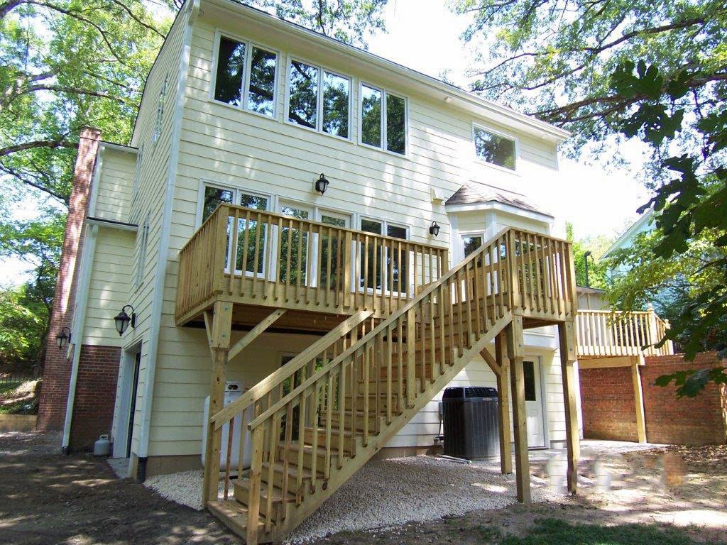 A newly constructed wooden deck and stairs on the exterior of a home by Rice Building Company in Rocky Mount, NC.
