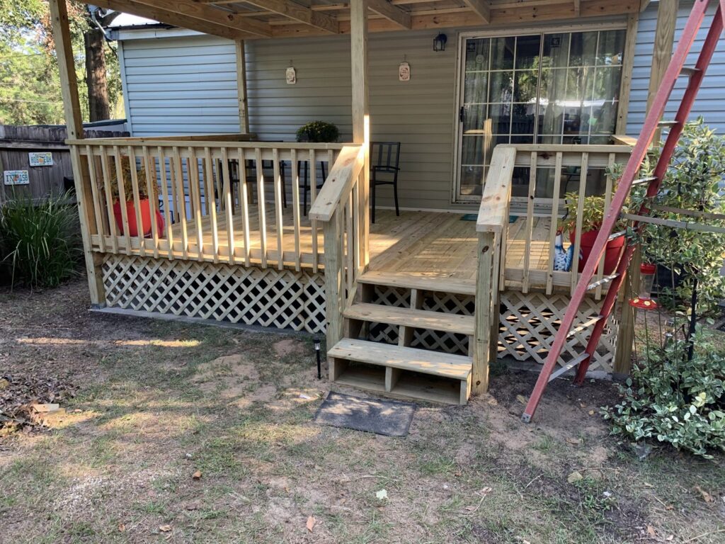 New wooden deck construction with stairs by Wall Doctor's Plastering LLC in Tallahassee, FL