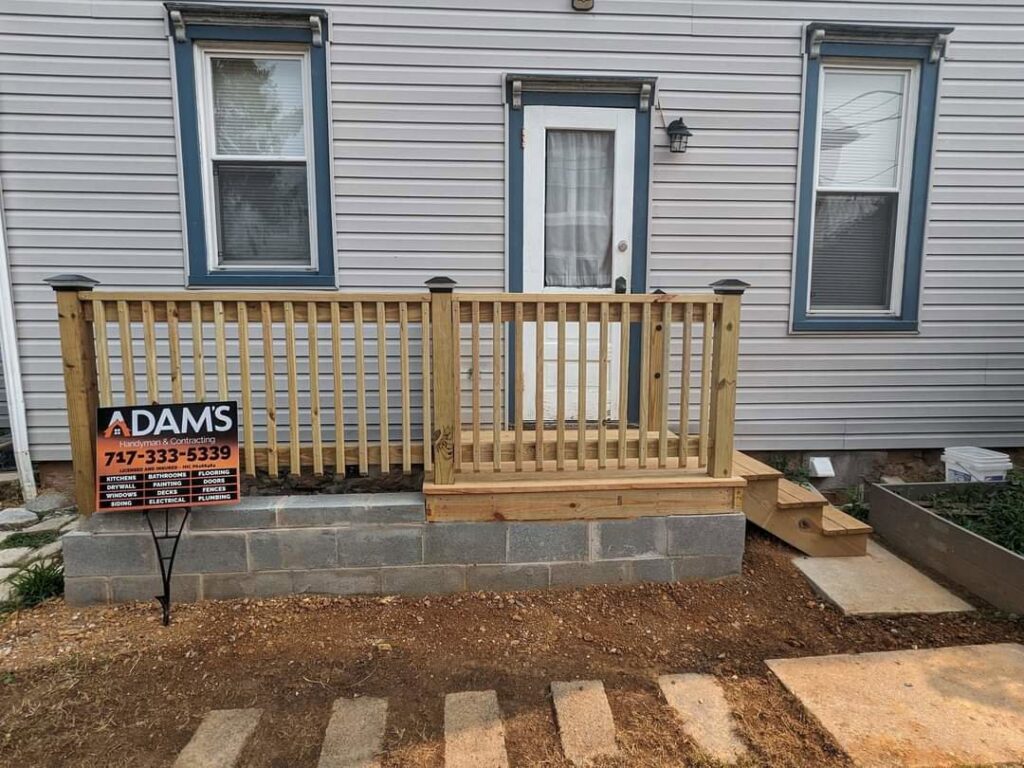 New wooden deck and railing installation by Adam's Handyman and Contracting in Lancaster, PA.