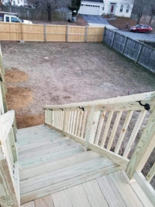 New wooden deck stairs and fence installation completed by DAC Construction, Inc. in Laurel, MD.