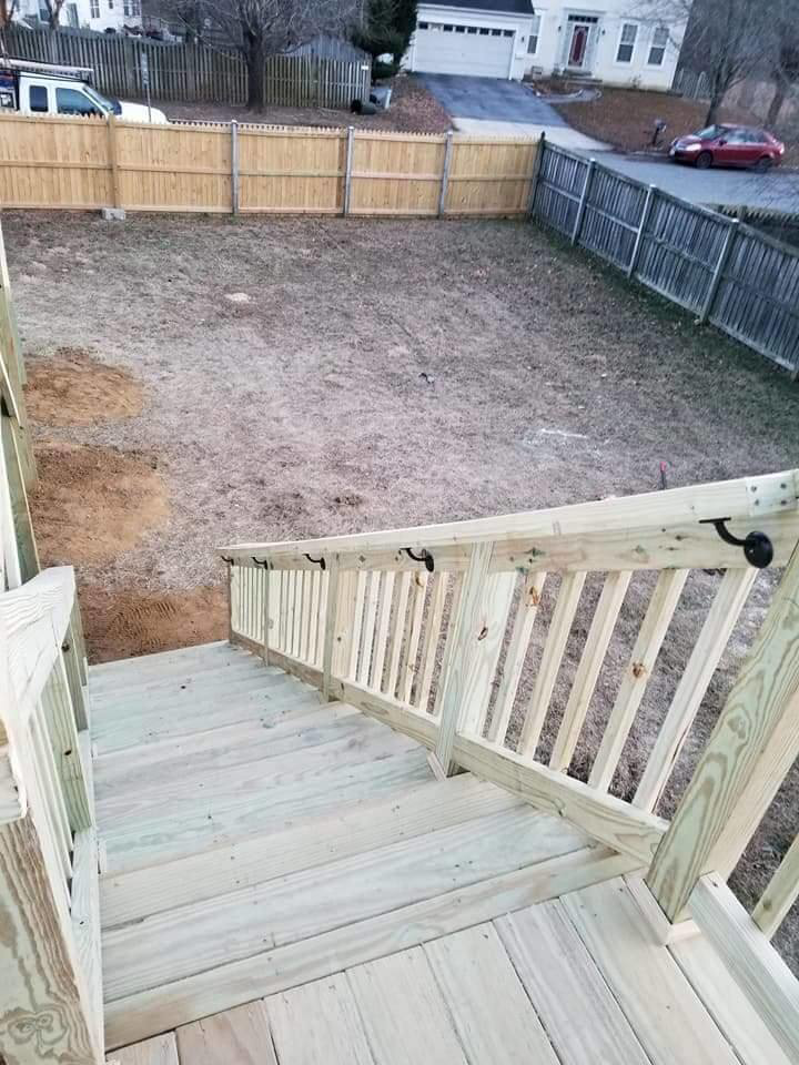 New wooden deck stairs and fence installation completed by DAC Construction, Inc. in Laurel, MD.