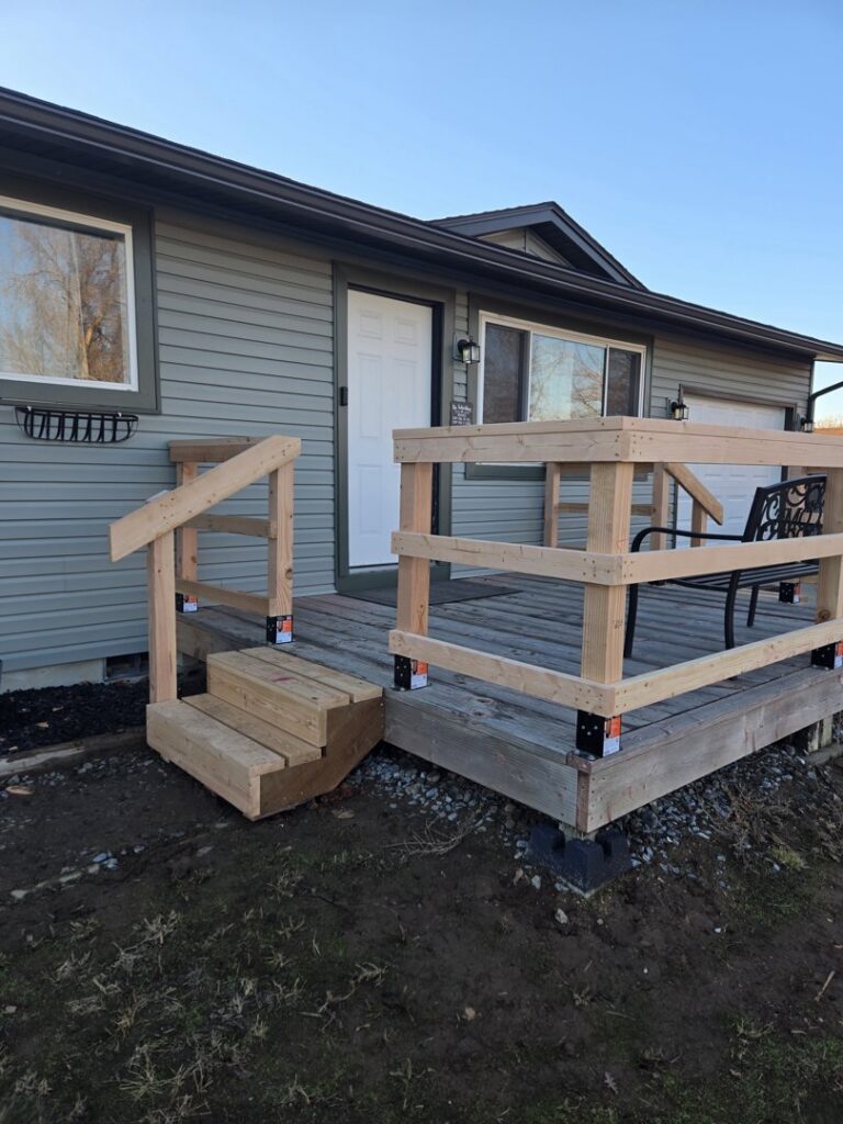 A newly installed wooden deck and stairs by Mr. Handyman of Boise, Meridian and Nampa in Nampa, ID.