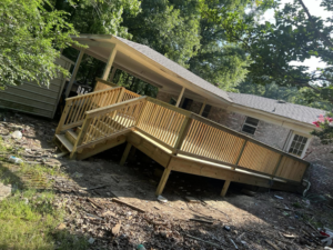 A newly constructed wooden deck with stairs and railings, showcasing quality craftsmanship by JD Handyman service LLC in Miami, FL.