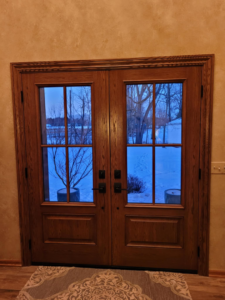 Interior view of newly installed wooden double doors by 1st Choice Windows, serving Canton, OH.
