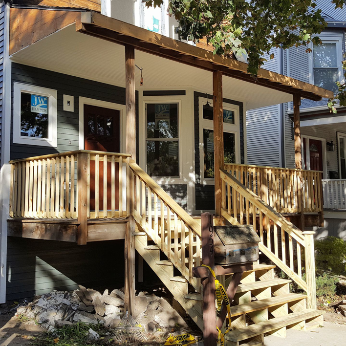 Newly constructed wooden porch and stairs on a residential home by F&S Construction Group in Chicago, IL.