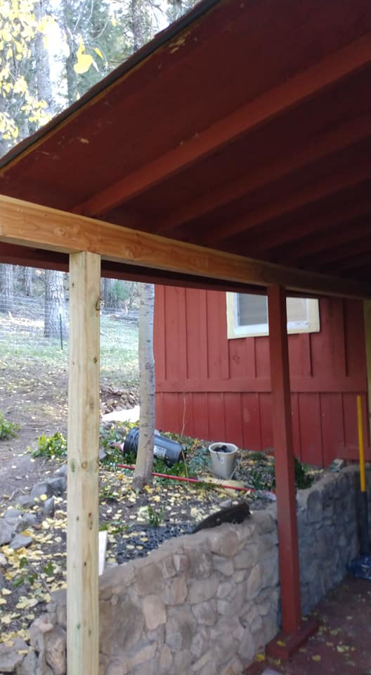Construction of a new wooden porch or overhang support structure by Handyman Heroes in Roswell, NM.