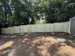 A newly installed wooden privacy fence in a backyard completed by Mr. GreenJeans in Indianapolis, IN.