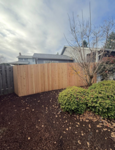 A newly installed wooden privacy fence by Reborn Construction LLC in Wilsonville, OR.