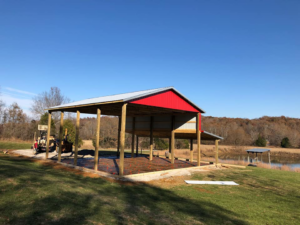 A newly built carport structure with a concrete slab foundation by Fairview Concrete in Hopkinsville, KY.