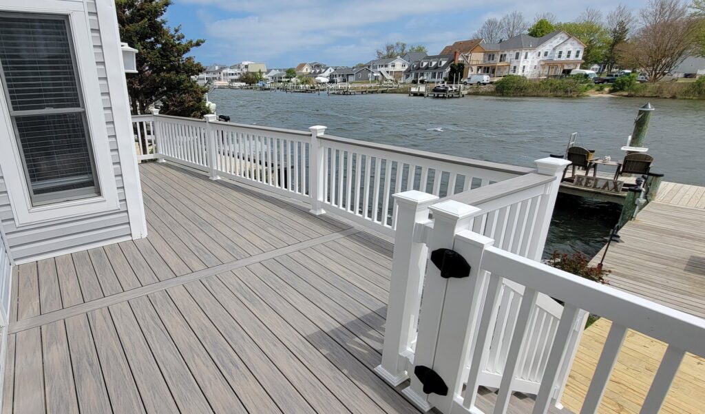 A newly built composite deck overlooking a waterfront by M. Phippin Contracting in Hebron, MD.
