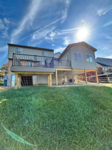 A newly built deck and sunroom addition on a house completed by Forward Construction in Florence, KY.