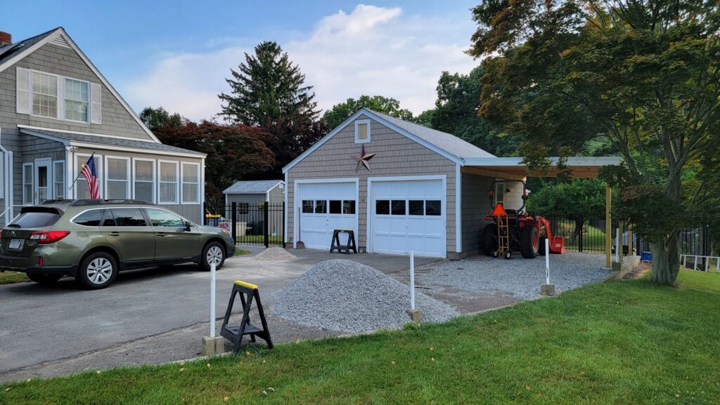 A newly built detached garage and carport by Wood Trades LLC in Westport, MA.