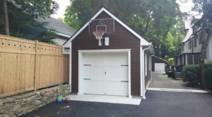 Newly built garage with a basketball hoop and new siding by Thomas J Stone GC in Yonkers, NY