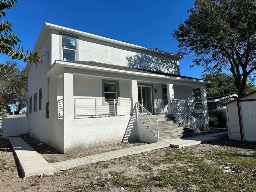 A newly built modern two-story house completed by Otero-Cossio Construction in Tampa, FL.