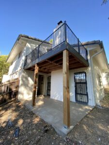 A newly built outdoor deck with a modern black railing, a project by Infinite Creations Construction, LLC in Denver, CO