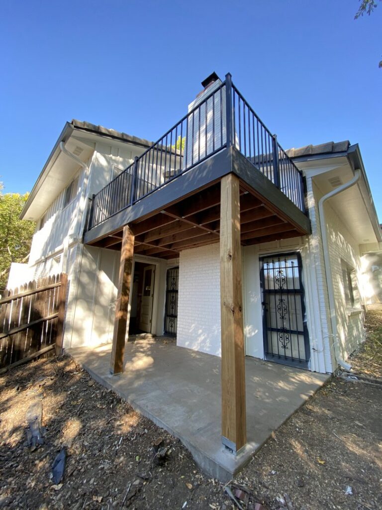 A newly built outdoor deck with a modern black railing, a project by Infinite Creations Construction, LLC in Denver, CO