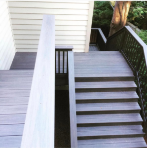 Newly built outdoor deck stairs and landing with composite decking by Kalau Builders LLC, providing handyman services in Eugene, OR.