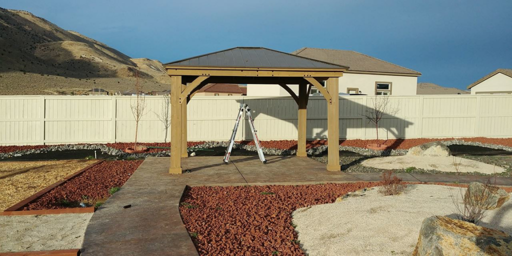 A newly built outdoor gazebo with a ladder, showcasing installation services by TNT Handyman Services LLC in Sparks, NV.