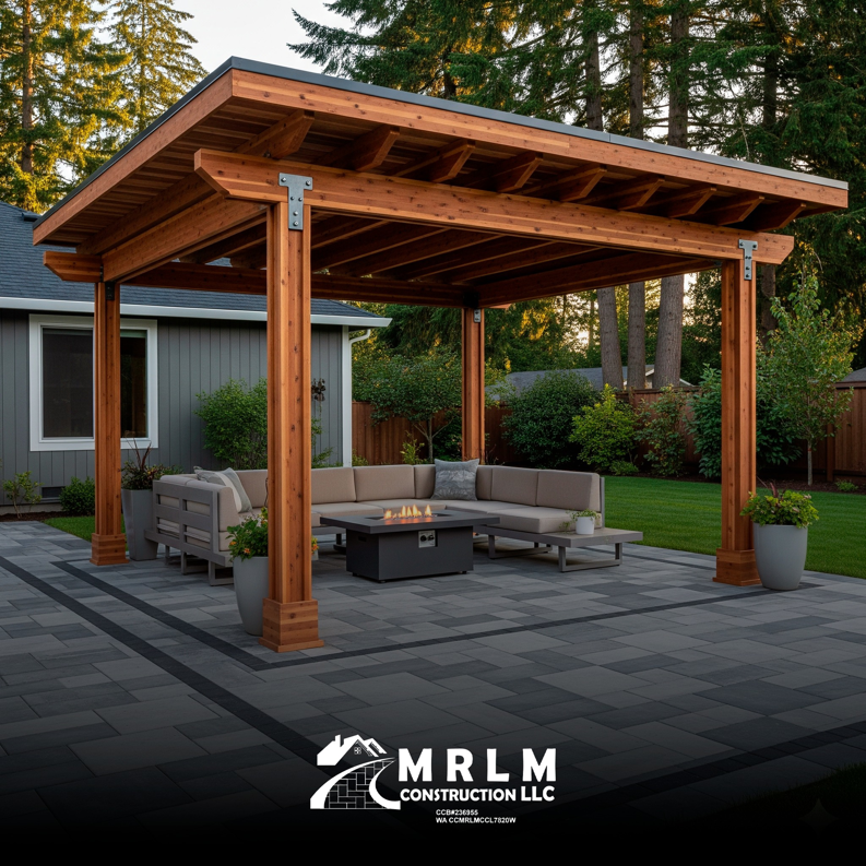 A newly built outdoor pergola and paved patio area, completed by MRLM Construction LLC in Beaverton, OR.