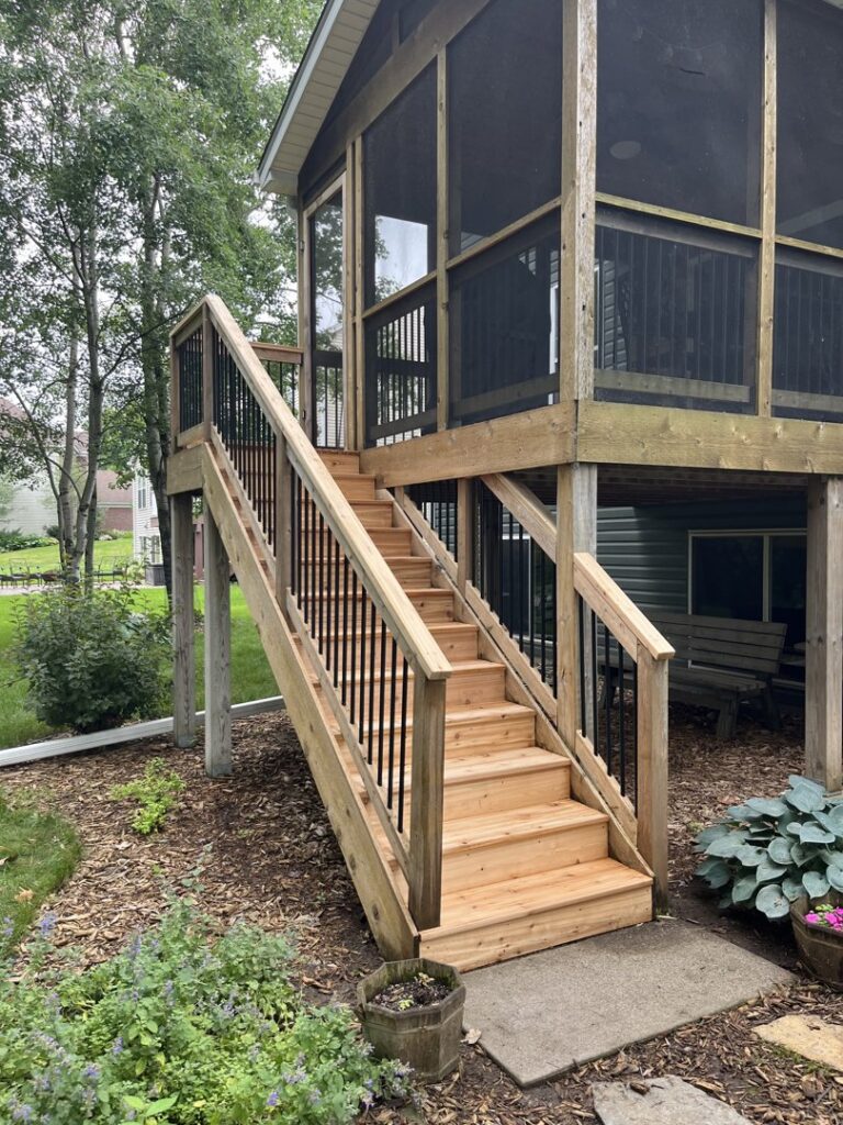 Newly constructed outdoor stairs leading to a screened porch, a project by Clear Choice Handyman LLC in Woodbury, MN.