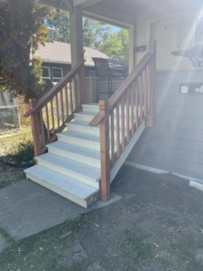 Newly built outdoor stairs with wooden railings by Simmons Handyman Services & Contracting LLC in Billings, MT