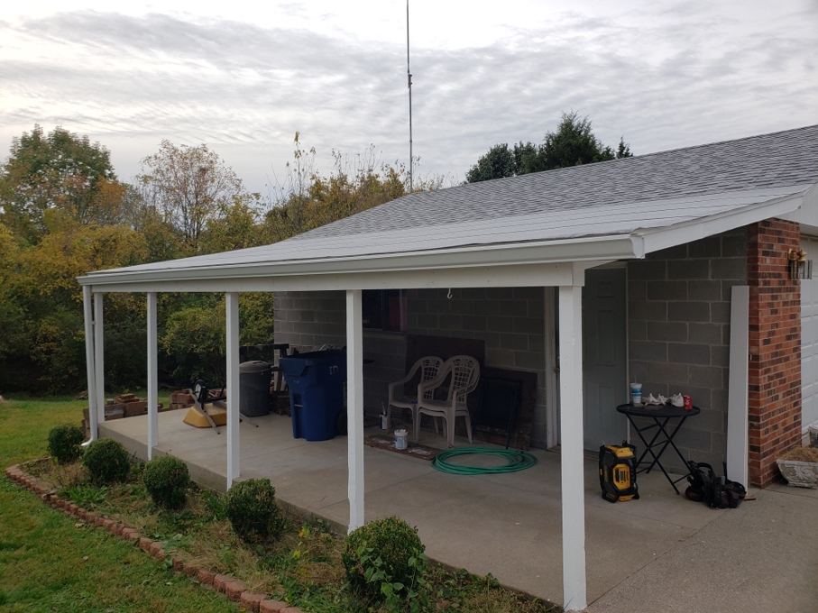 A newly built patio cover or carport structure attached to a garage by A1 Roofing in Scottsdale, AZ