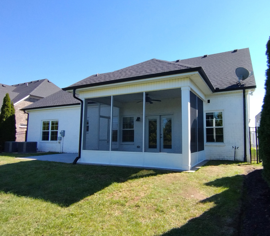 A newly built screened porch addition on a white brick house by Affordable Home Improvement LLC in Pleasant View, TN.