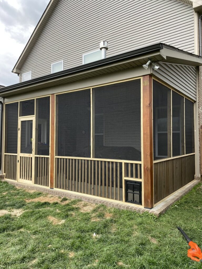 A newly constructed screened porch with wooden framing and dark screens, built by Richwood Remodeling & Outdoor in Nashville, TN.