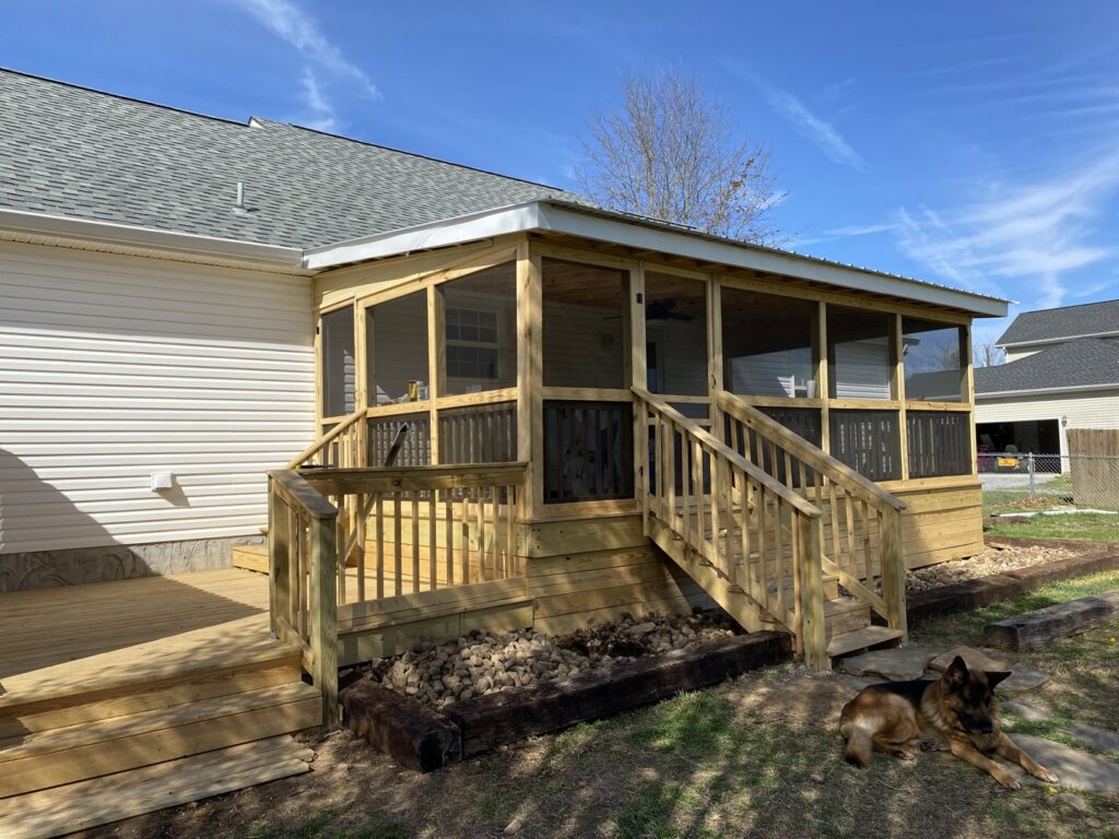 A newly constructed screened porch with wooden framing and steps, completed by Richwood Remodeling & Outdoor in Nashville, TN.