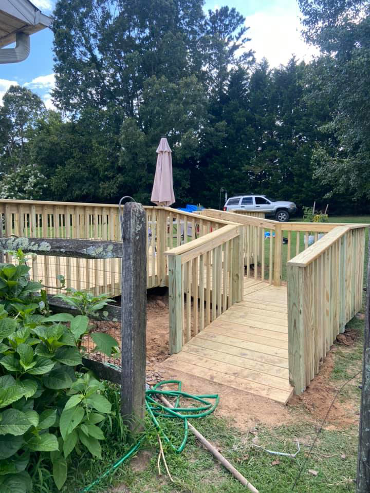 A newly built wooden access ramp leading to a deck by LDT Construction Services in Spring Hill, FL.