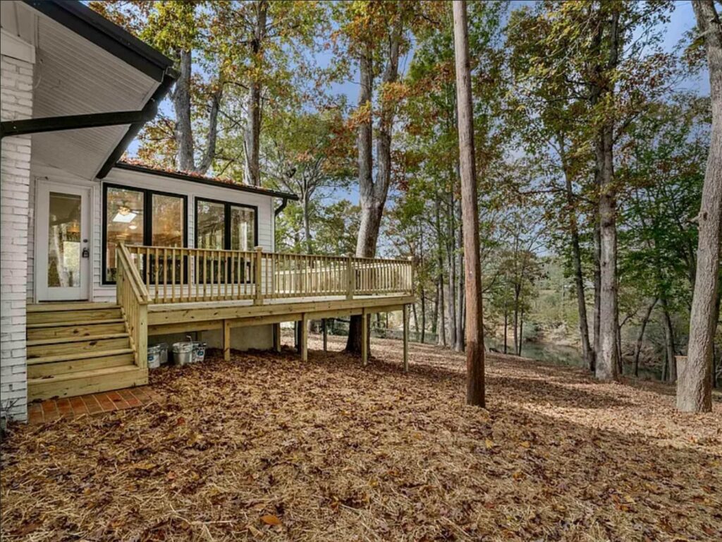 A newly built wooden deck on the exterior of a house, completed by GCI Services, Inc. in Simpsonville, SC