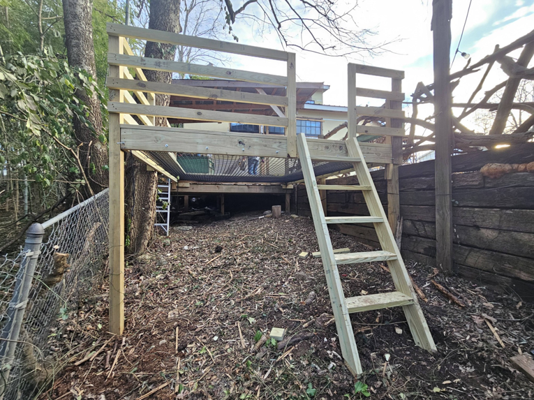 A newly built wooden deck platform with a ladder constructed by Carter Remodeling in Cartersburg, IN.