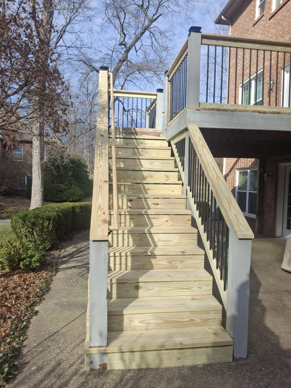 Newly built wooden deck stairs, part of a renovation project by American Renovation Llc in Fairplay, SC.