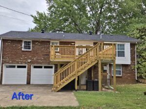 The exterior of a house showcasing a newly built wooden deck and stairs, a construction project by Huff Consolidated Enterprises LLC in Clarksville, TN.