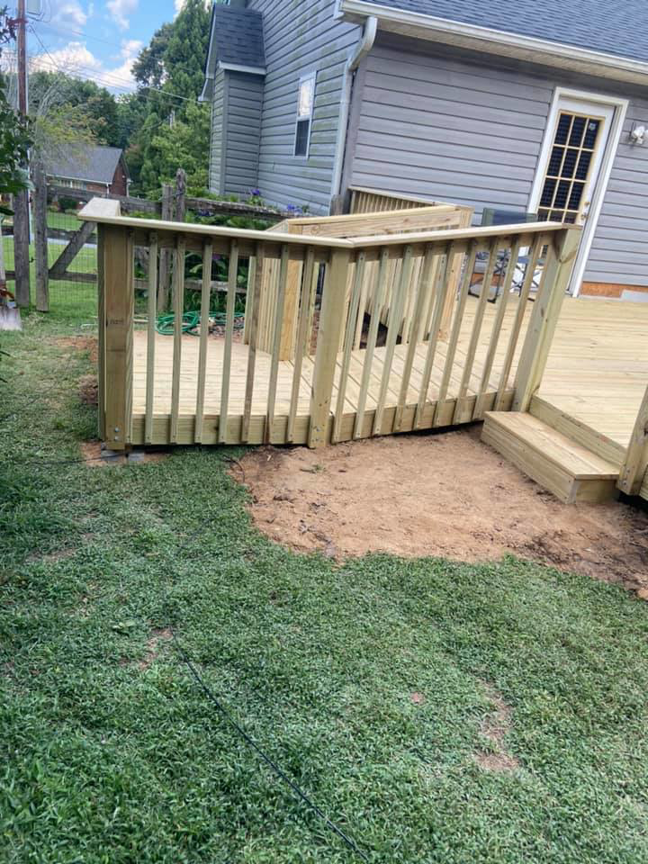 A newly built wooden deck with sturdy railings by LDT Construction Services in Spring Hill, FL.