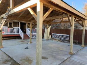 A newly built wooden patio cover structure by Barreto's Family Construction Company in Dayton, OH.