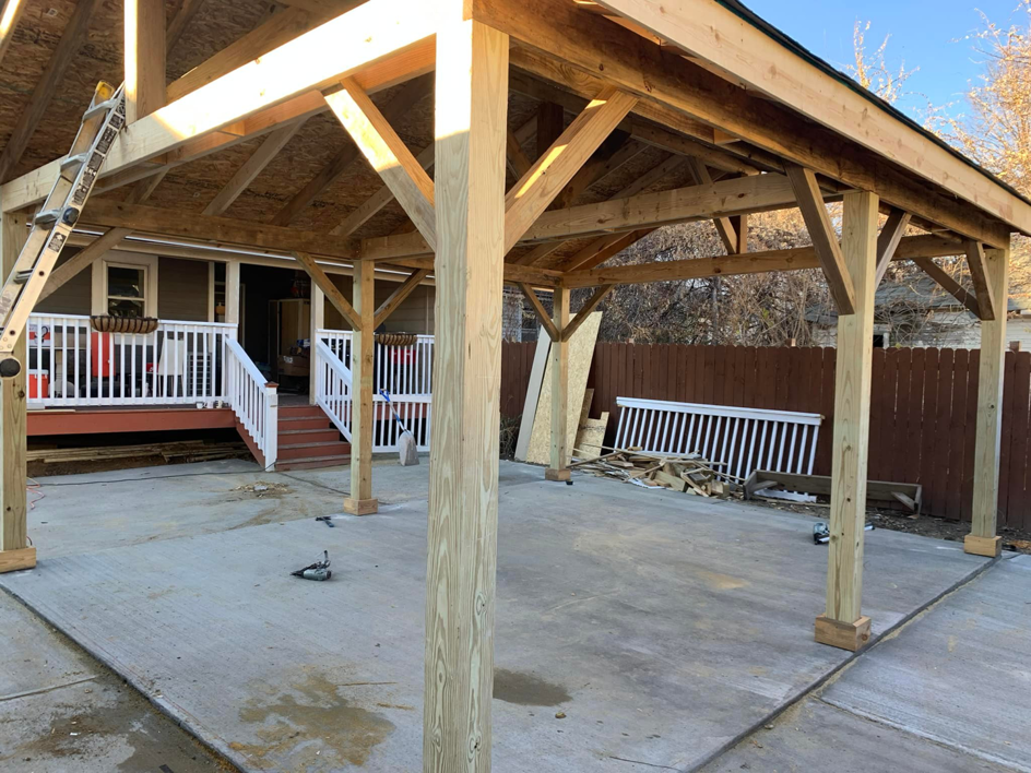 A newly built wooden patio cover structure by Barreto's Family Construction Company in Dayton, OH.