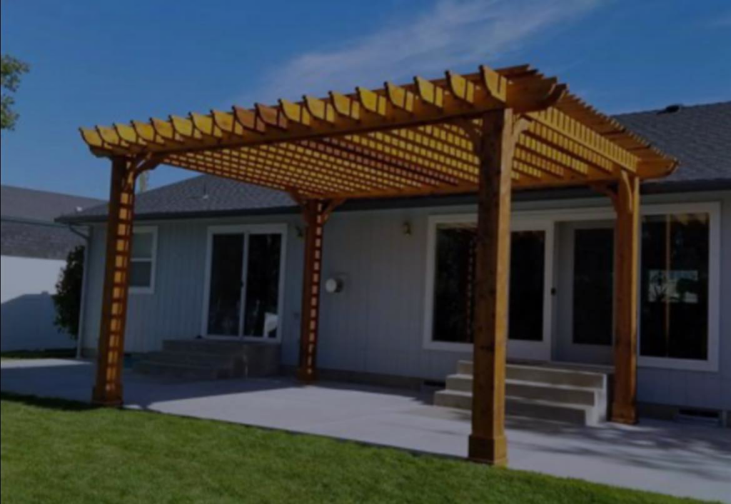 A newly built wooden pergola installed over a concrete patio by Atlanta Handyman and Repair LLC in Johns Creek, GA.