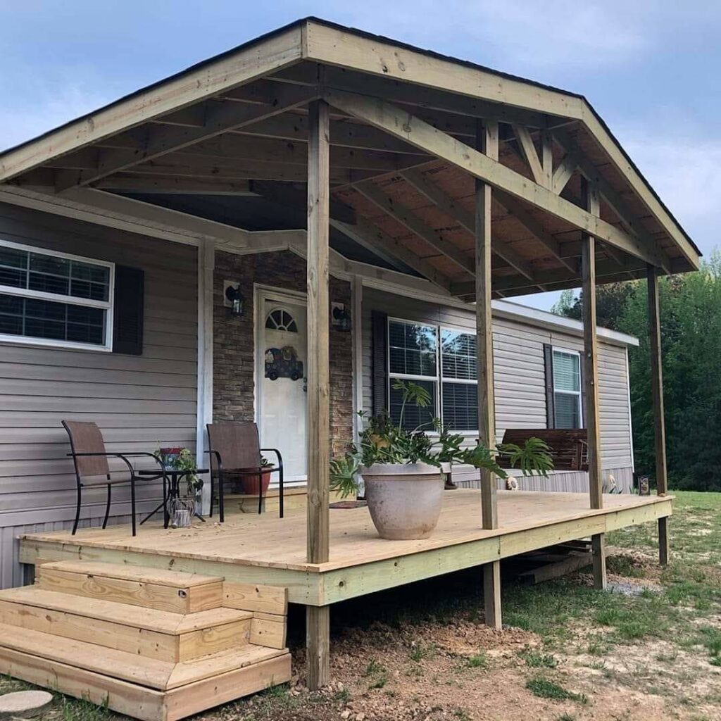 A newly constructed wooden porch and deck with a roof structure, built by Lee's Handyman Service LLC in Oxford, MS.