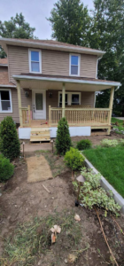 A newly built wooden porch and steps completed by Indoor/Outdoor Home Repairs in Parma, OH.