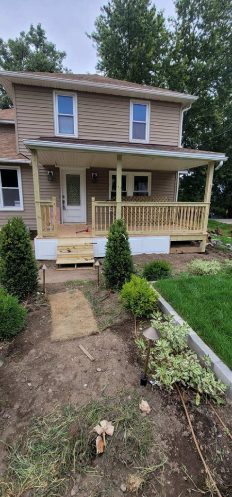 A newly built wooden porch and steps completed by Indoor/Outdoor Home Repairs in Parma, OH.